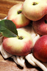A group of ripe peaches on table