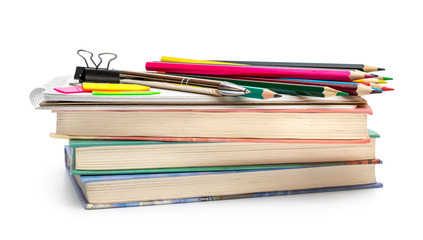 School supplies on stack of books.