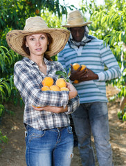 Woman with peaches in hands