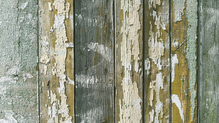Fototapeta na wymiar Old wooden fence painted in different colors