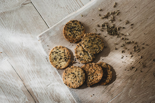 High angle close up of freshly baked seeded crackers.