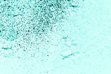 Vintage azure background. Rough painted wall of turquoise color. Imperfect plane of cyan colored. Uneven old decorative toned backdrop of aqzure tint. Texture of teal hue. Ornamental stony surface.