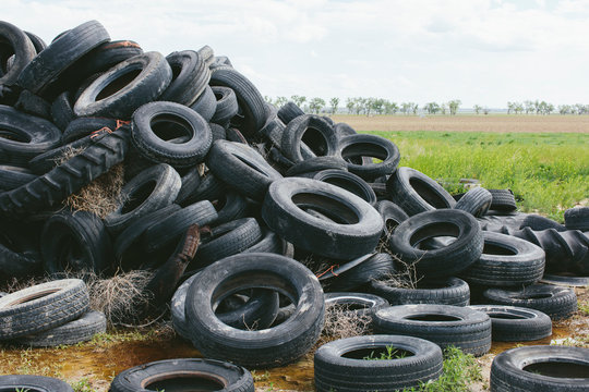 Pile of discarded auto tires, farmland in distance, near Cimarron, Kansas,Pile of auto tires
