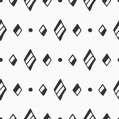 Abstract seamless hand drawn pattern of rhombuses and dots. Doodle style illustration.