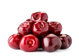 Heap of red cherries close-up on a white. Isolated.