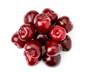 Heap of ripe cherries isolated on a white.The form of the top.
