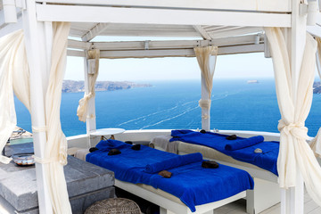Sea view. Balcony of the hotel, which has two sun lounges in blue. Romantic vacation by the sea