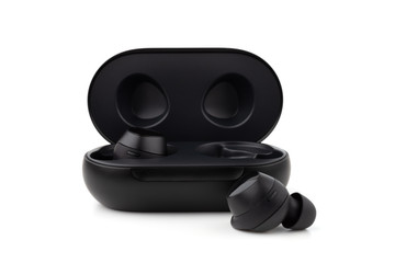 Wireless headphones on a white background. Headset close up in the charging case close-up.