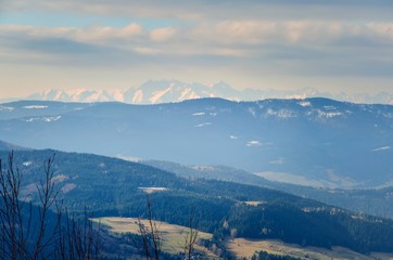Fototapeta premium Beautiful spring mountain landscape. A rural view of the Polish Tatras and valleys from the surrounding mountains.