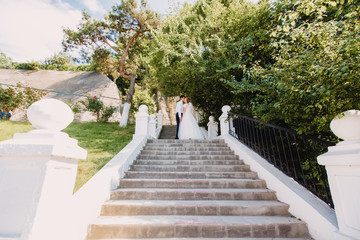 woman walking on wooden bridge in park