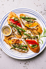 Toasts (sandwiches) with cheese, pepper and asparagus