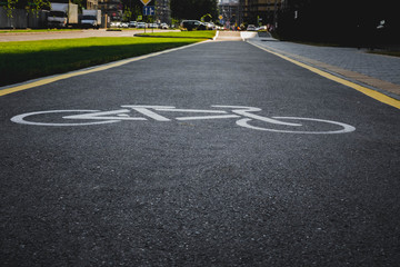 Fototapeta premium half wet after the rain asphalt road for cyclists.