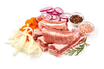 Raw meat ribs with rosemary and spices, ingredients for cooking, close-up, isolated on white background