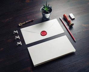 Vintage envelope and retro stationery on wooden background.