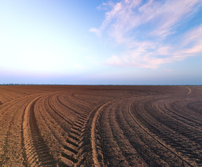 agriculture the land is ploughed to the field / background photo out of the city agriculture