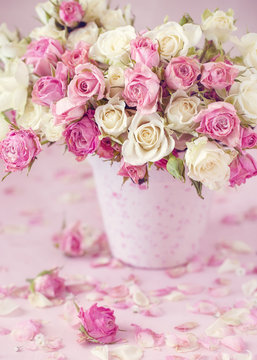 Close-up floral composition with a pink roses .Many beautiful fresh pink roses on a table.Pastel colors.