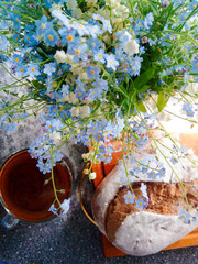 bouquet of forget-me-nots and bread