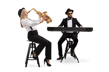 Female saxophonist and a male keyboard player