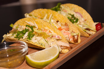 Mexican food. Delicious Tacos Honey Mustard Chicken with Cole Slow Salad and Salsa Verde Sauce