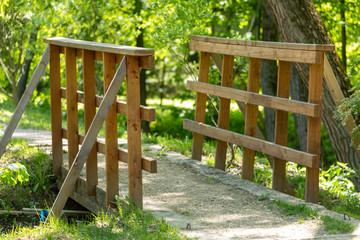 Wooden bridge over a stream in the forest