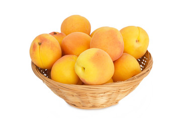 Bowl of apricots isolated on white background