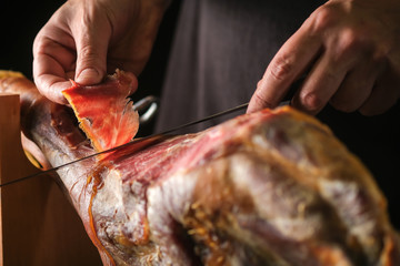 Dry Spanish ham, Jamon Serrano, Bellota, Italian Prosciutto Crudo or Parma ham, whole leg isolated on black background