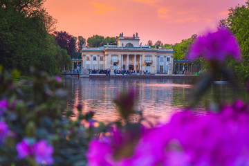 Royal Palace on the Water in Lazienki Park, during the sunset, Warsaw, Palace on the water in the...