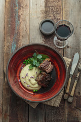 Braised beef ribs with parsnip puree and sauce, restaurant dish