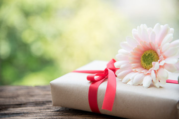 red ribbon gift and flower