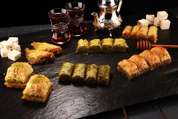 Middle eastern or arabic dishes. Turkish Dessert Baklava with pistachio on dishes