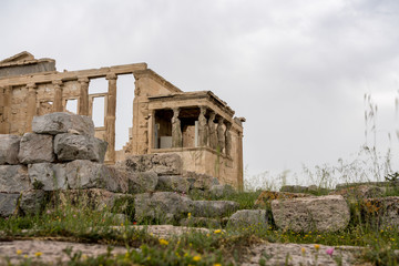 Fototapeta premium Ancient statues of the Caryatids on the Erechtheion or Erechtheum temple in Acropolis