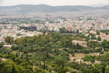 Fototapeta na wymiar Aerial view of Temple of Hephaestus in Greek Agora and broader city of Athens taken from the Acropolis