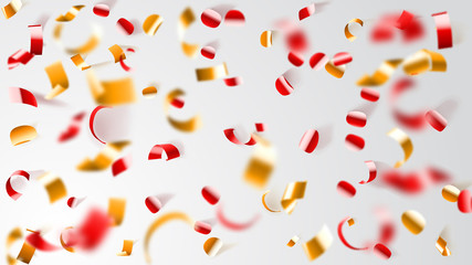 Abstract background of flying shiny confetti and pieces of serpentine, golden and red on white