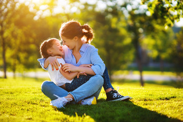 happy family mother and child daughter in nature   in summer