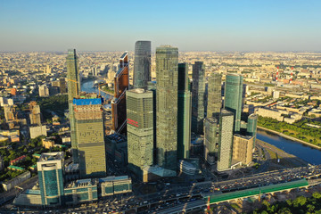 Fototapeta na wymiar Aerial view of the skyscrapers of the business center of Moscow and highway at sunset