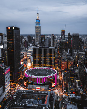 View From Top On Madison Square Garden And Empire State Building. Night Lights