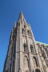 Fototapeta premium Architectural fragments of Roman Catholic Chartres Cathedral or Cathedral of Our Lady of Chartres (Cathedrale Notre Dame de Chartres, 1220). Chartres (80 km southwest of Paris), Eure-et-Loir, France