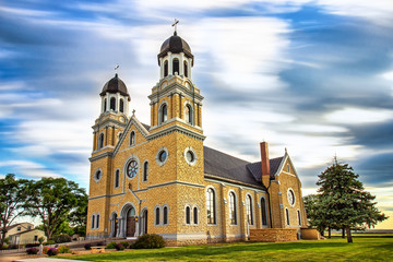 Fototapeta na wymiar Damar, KS USA - Beautiful St. Joseph Catholic Church in the French-American Village of Damar in Western Kansas