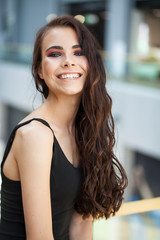 Make up beauty. Close up portrait young brunette woman in black dress