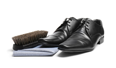Stylish men's footwear and shoe care accessories on white background