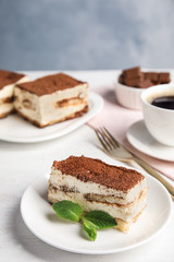 Tiramisu cakes and drink served on table