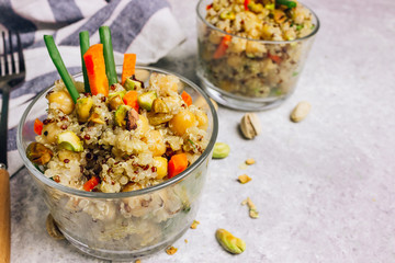 chickpea and quinoa salad with cashews, raisins, green onions and carrots