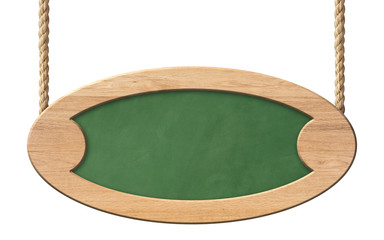 Old oval green blackboard with bright wooden frame hanging on ropes