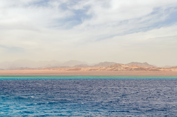 Mountain landscape with blue water in the national park Ras Mohammed, Egypt.