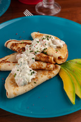 Soft pancakes with avocado and cream cheese for healthy breakfast