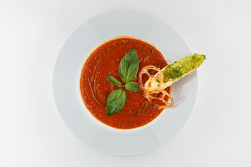 Vegetarian gazpacho with croutons on a white background