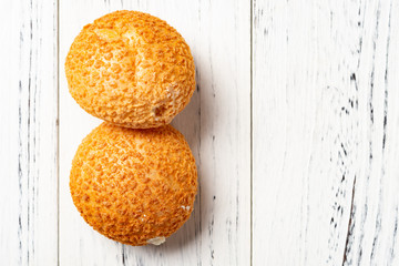 top view two pieces sweet puffs on a white wood table with copy space