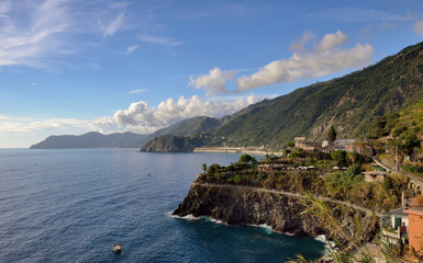 Manarola, Liguria, Italy fisherman village, colorful houses on sunny warm day. Monterosso al Mare, Vernazza, Corniglia, Manarola and Riomaggiore, Cinque Terre National Park UNESCO World Heritage