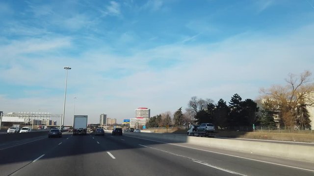 Driving On Freeway With Ontario Signage And Buildings