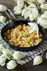 Yucca flowers dish. flower petals fried with eggs and tomatoes. national cuisine of Costa Rica. edible flowers recipe. Yucca is the national flower of Costa Rica